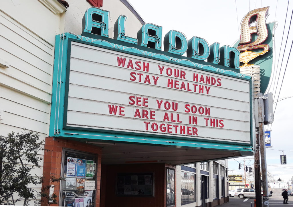 Marquee of the Aladdin Theater with the message: Wash your hands, stay healthy. See you soon. We are all in this together.